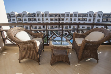 Chairs and table on balcony
