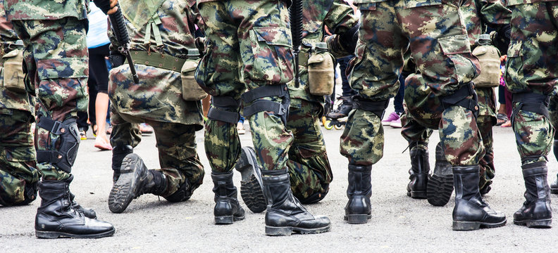 Soldier standing in defensive line .