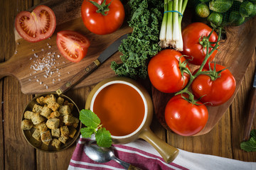 Table top view on fresh tomato soup preparation