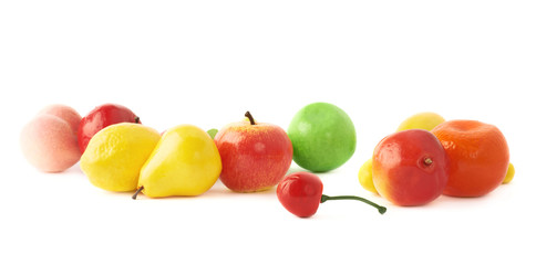 Pile of multiple artificial plastic fruits and berries