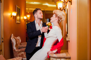 Groom and bride together. Wedding couple in room