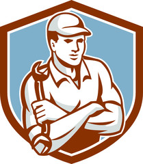 Mechanic Holding Spanner Arms Crossed Shield
