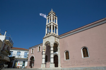 Fototapeta na wymiar Bell tower on the central square in Skiathos