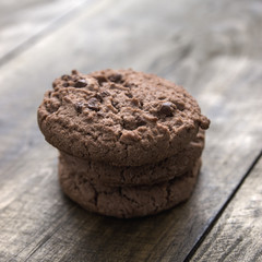 Chocolate chip cookies on wooden background