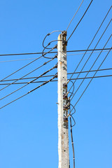 Electrical wire on pole. chaotic wire with nest on pole