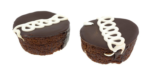 Two chocolate iced cakes on a white background