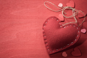 Textile toy in the shape of heart on Valentine's Day. Space for