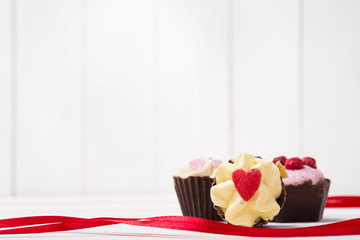 Chocolate candies with the symbol of the day of lovers. Space fo