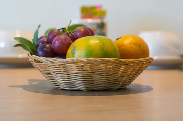 Wicker baskets of fruit on the table.