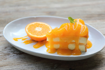 Orange cake on wood background