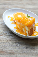 Orange cake on wood background