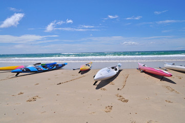Fototapeta na wymiar Colorful kayaks on the tropical beach. Gold Coast, Australia