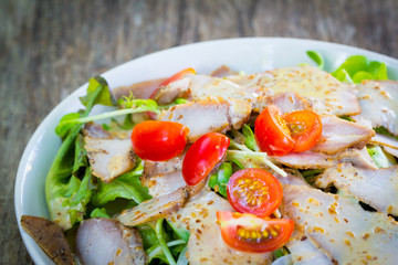 Roasted pork salad on plate