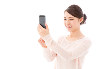 Fototapeta premium young asian woman taking photo