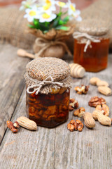 Honey in the pot and nuts