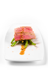 Tuna salad and asparagus on a white plate