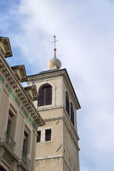 Exterior of church against cloudy sky