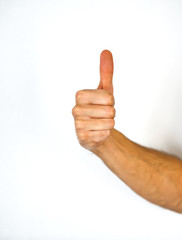 Male hand giving a thumbs up gesture