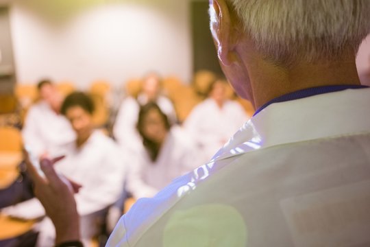 Science Professor Giving Lecture To Class