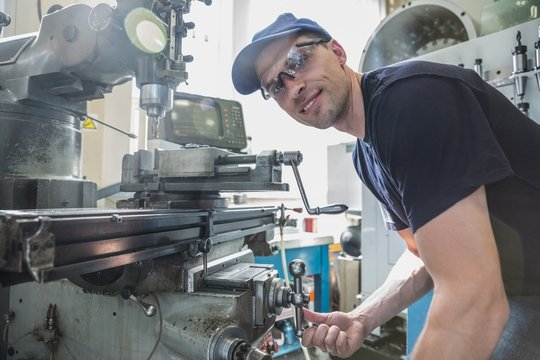 Engineering Student Using Large Drill