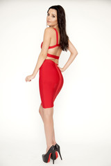 Fototapeta na wymiar Young slim sexy woman in red dress isolaten on white background