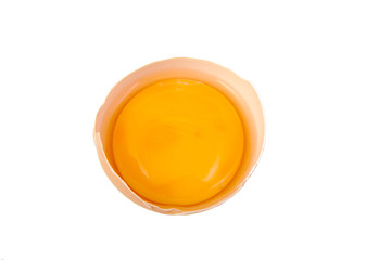 Yolk in broken egg isolated on white background.