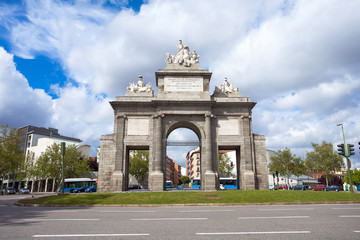 Fototapeta na wymiar Gate of Toledo (Puerta de Toledo) on a sunny spring day in Madri