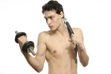 Fototapeta na wymiar Skinny man training bicep muscle. Teenager lifting a dumbbell