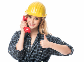 Handwerker mit Telefonhörer zeigt Daumen hoch