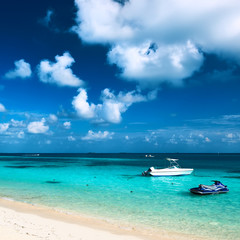 Beautiful island beach with motor boat