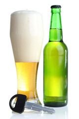 Composition with car key and bottle of beer, isolated on white