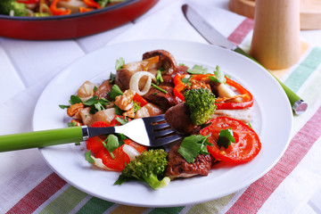 Braised wild mushrooms with vegetables and spices in pan and