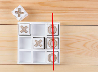 Game of Tic Tac Toe on wooden background