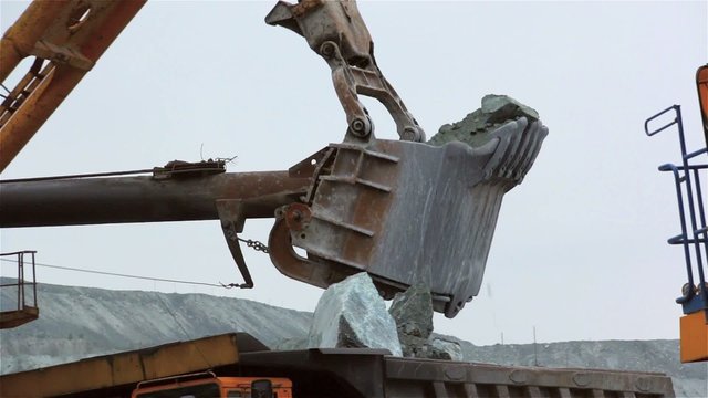 Excavator bucket loads BelAZ