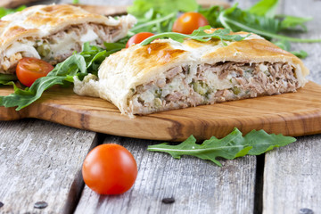 pie of puff pastry with tuna, rice and egg