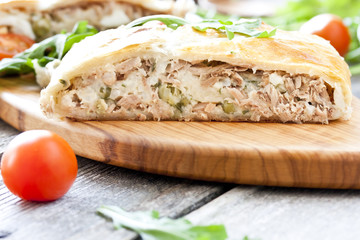 pie of puff pastry with tuna, rice and egg