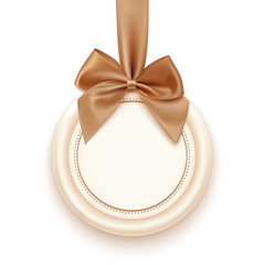 Blank badge with golden ribbon and bow.