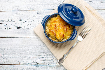Moshroom casserole in a blue ceramic pot