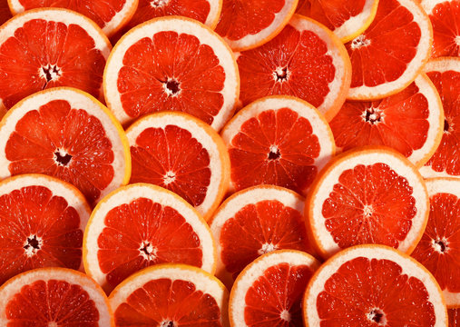 Sliced grapefruit as a background.