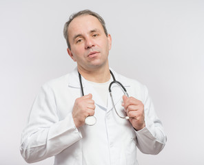 serious male doctor with stethoscope