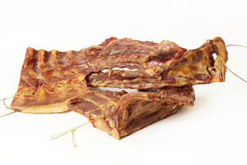 Pork dried meat in traditional way in homemade smokehouse