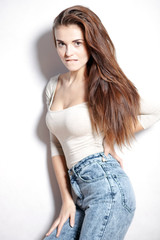 Woman with long hair in high waisted jeans