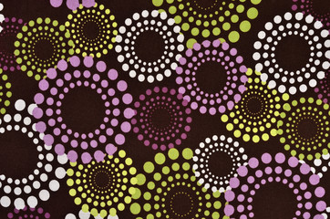 Purple, green polka dots circles pattern on dark background.