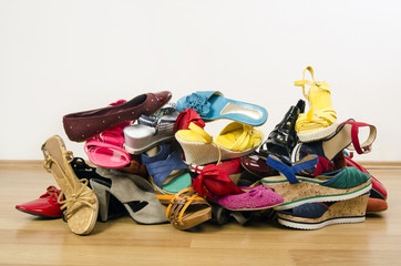 Big pile of colorful woman shoes. - 76063238