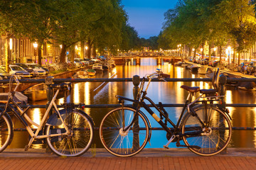 Night  illumination of Amsterdam canal and bridge