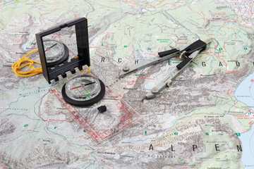 Compass and divider caliper on a hiking map