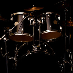 Fototapeta na wymiar Fragment of a drum kit in dark colors