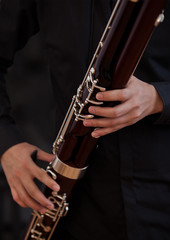 Human hand playing the bassoon