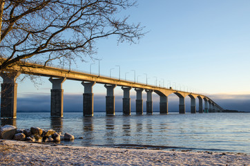 Fototapeta na wymiar Winter beach by the bridge