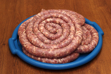 Rings of sausage on the blue tray